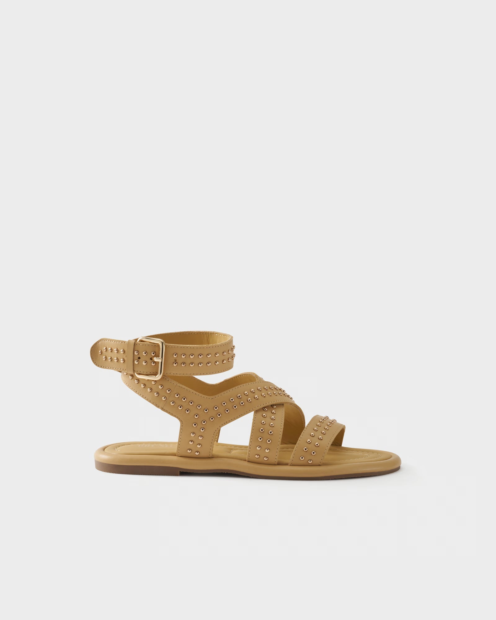Flat sandal in leather with studs