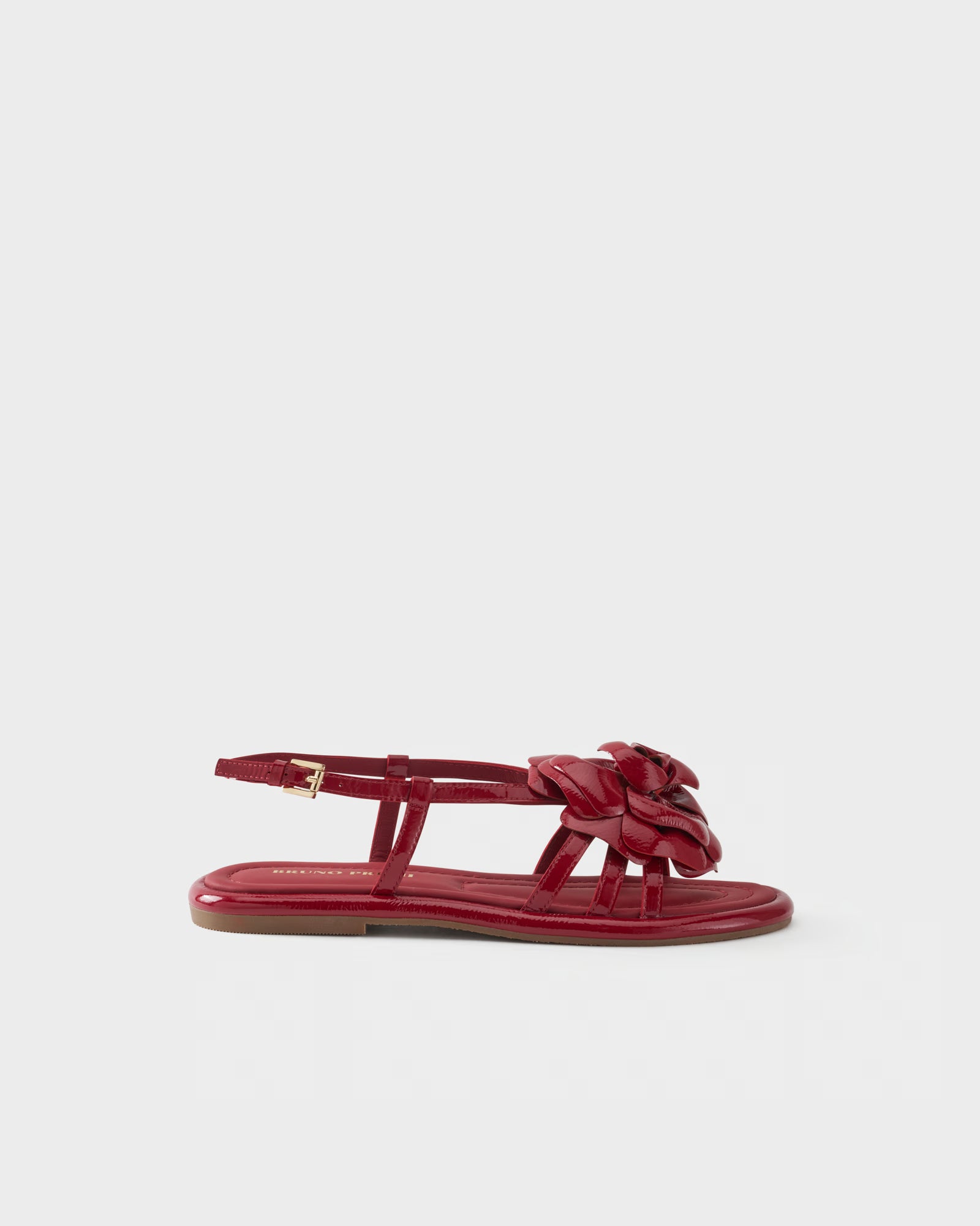 Sandalo flat in vernice con applicazione floreale