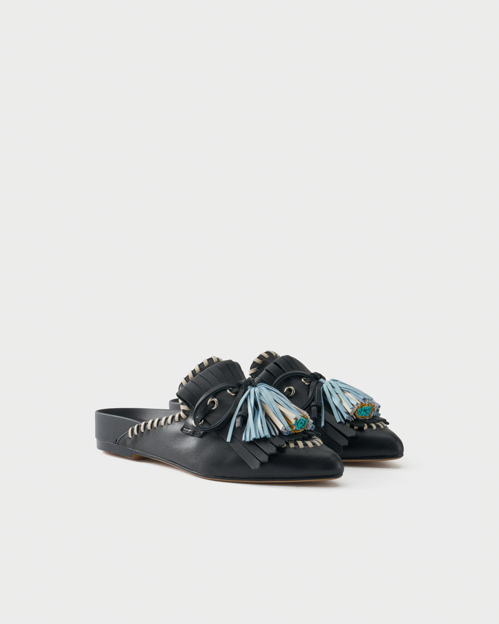 Flat mule in nappa leather with fringes