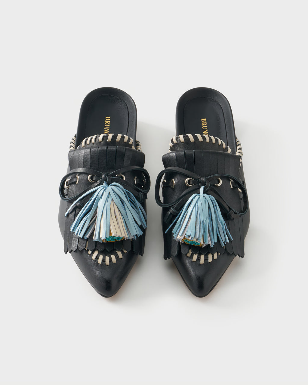 Flat mule in nappa leather with fringes