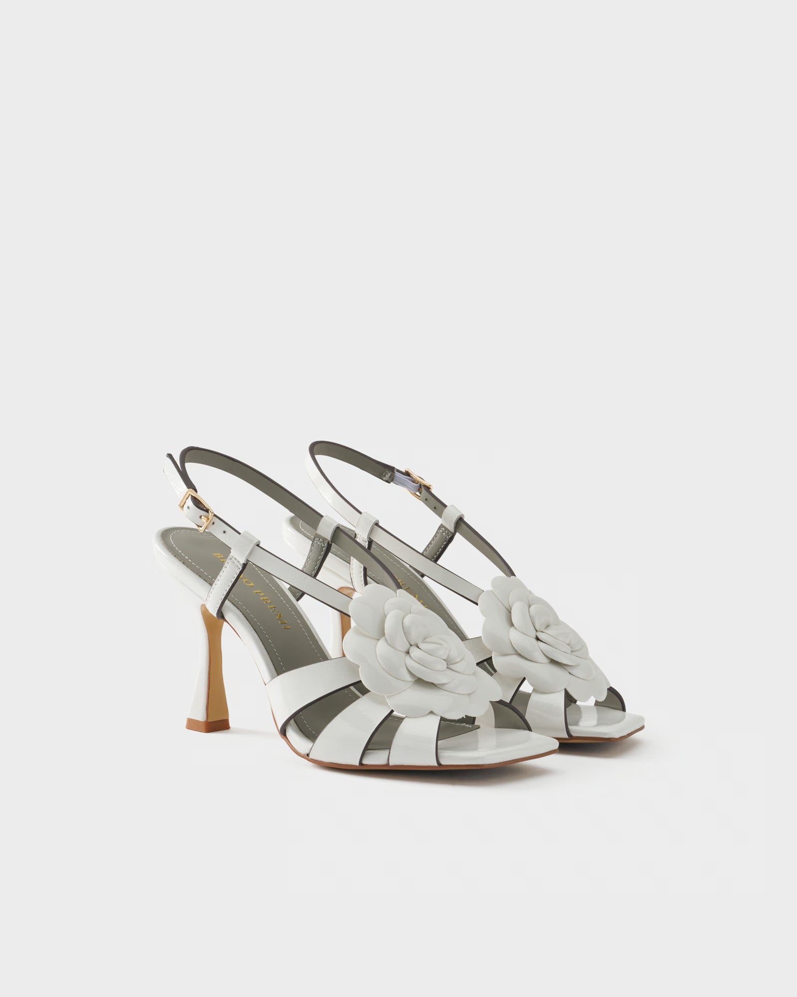 Slingback sandal in patent leather with floral embellishment